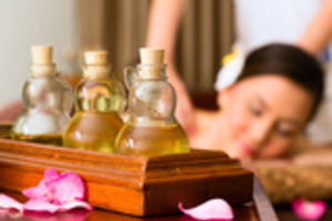 Chinese Asian woman in wellness beauty spa having aroma therapy massage with essential oil, looking relaxed